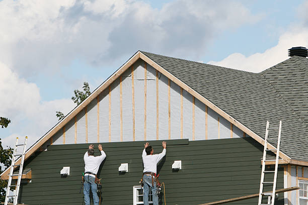 Professional Storm Damage Siding Repair technician working in New Enterprise, PA